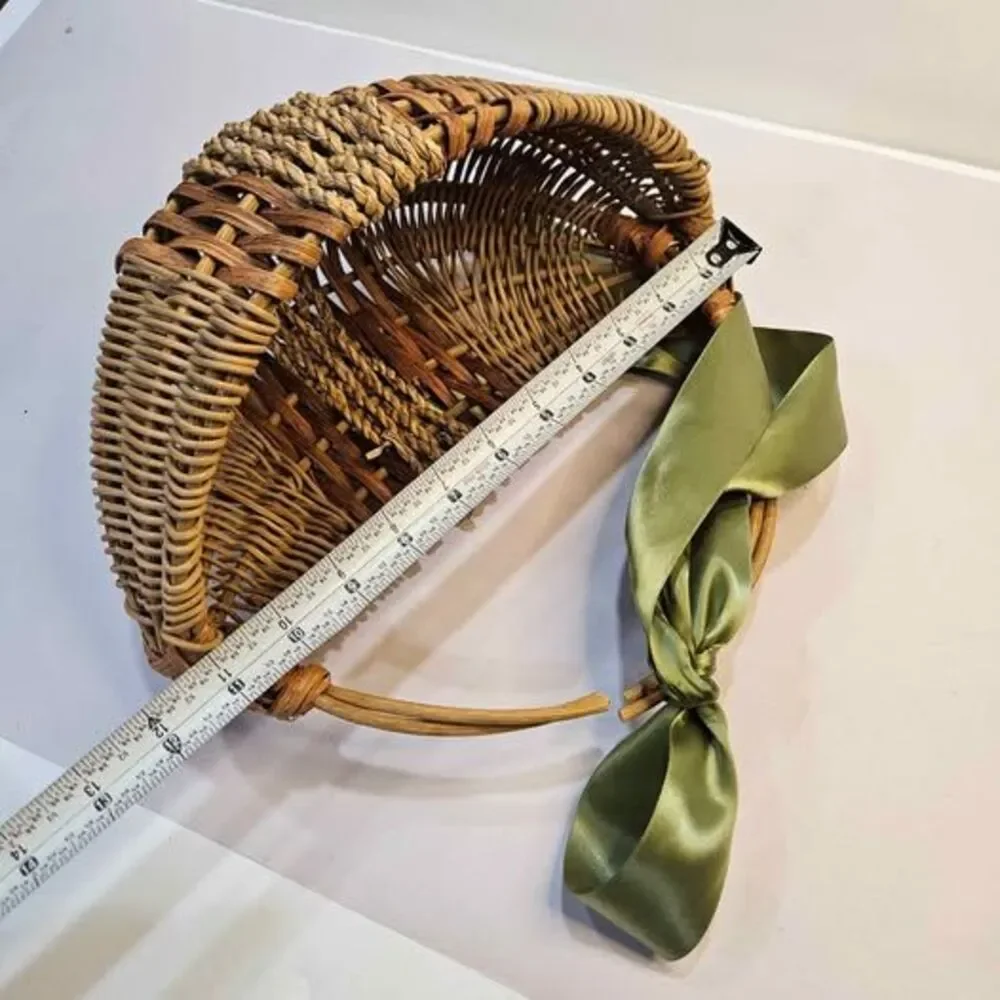 Wicker Basket with Green Ribbon, Broken Handle. Flat side. Wall decor